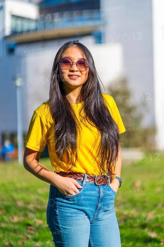 Vertical portrait of a beauty cool chinese exchange student in the campus