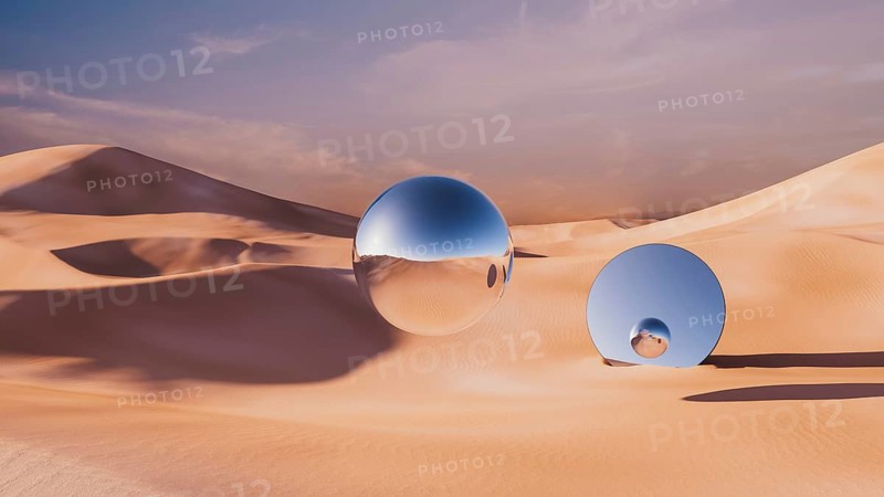 Explore a surreal desert landscape where smooth metallic spheres reflect the warm light in a tranquil dune setting at sunset
