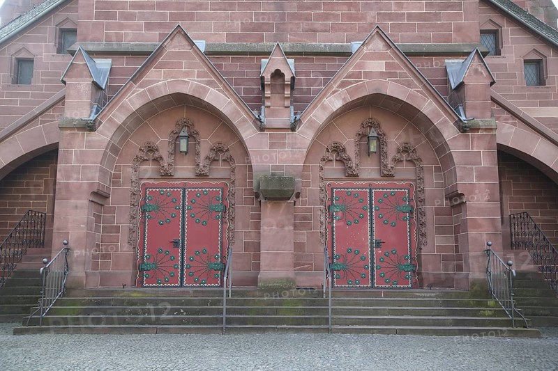 Portal of the neo-gothic Oranier Memorial Church, two red church doors, Wiesbaden, Biebrich, Hesse, Germany