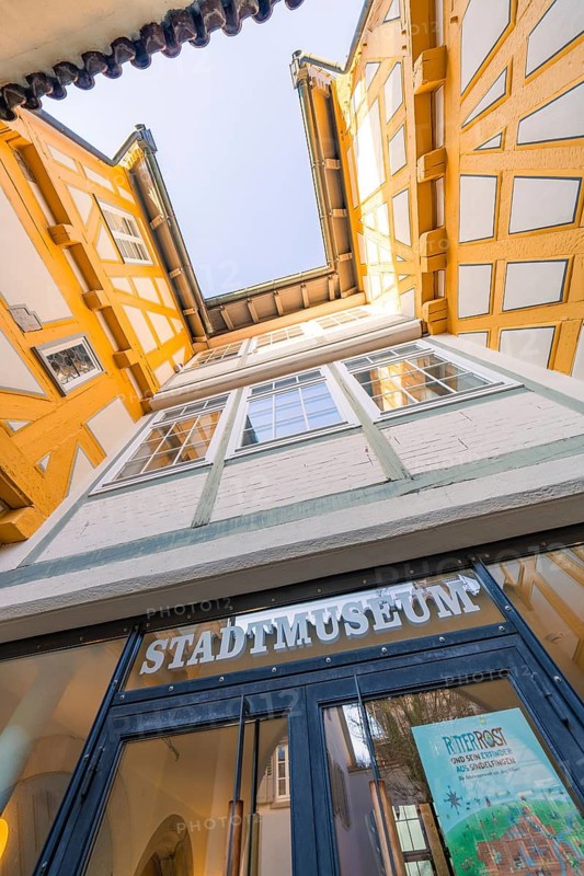 View from below of the entrance to a yellow half-timbered museum, Sindelfingen, Böblingen district, Germany