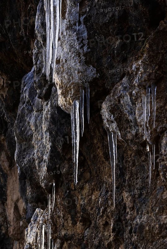 Icicles hanging on a rock face, winter, Salzkammergut, Austria
