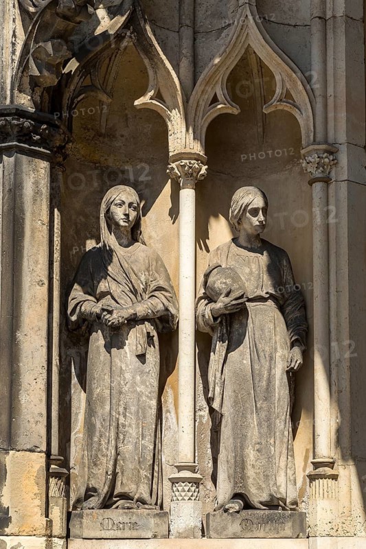 Mary and Martha as large figures at the entrance to St James' Church, Freiberg, Saxony, Germany