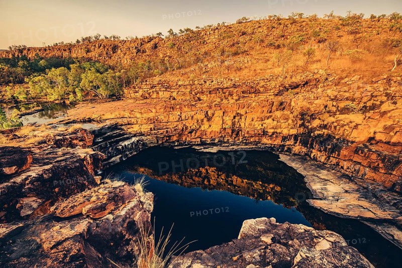 Bell Gorge waterfall, a body of water in north-west Australia in the Kimberley. Sunrise in the outback, Australia