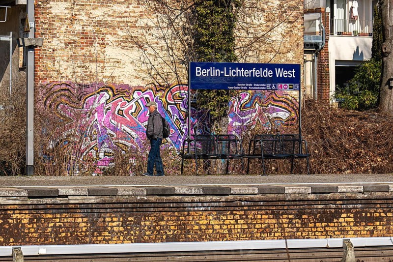 S-Bahn platform with passengers and historic structures at Lichterfelde West railway station, Berlin, Germany