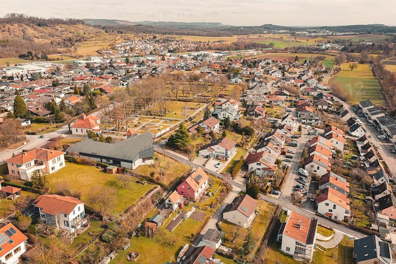 Aerial view of a medium-sized town with red roofs and surrounding rural landscape, Ötisheim, Enzkreis, Germany