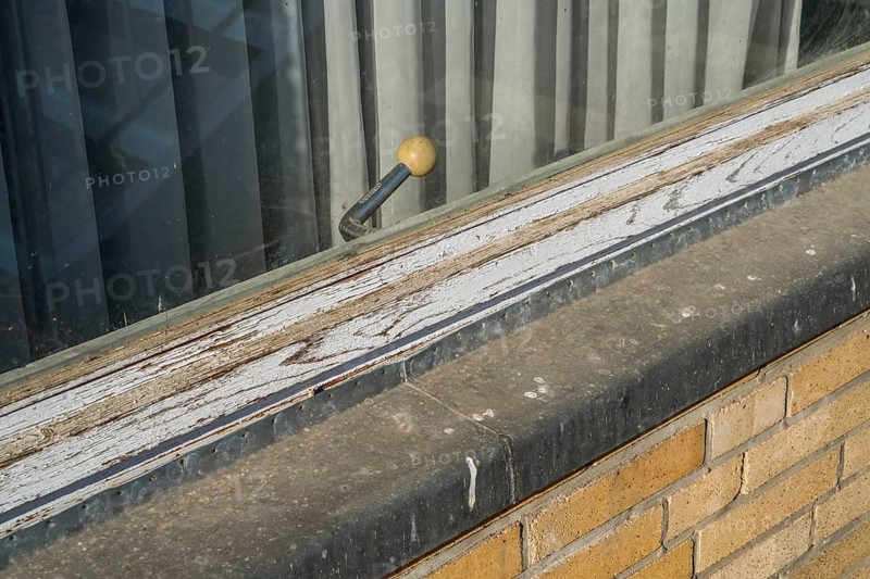 Old building, casement window with a rotary handle