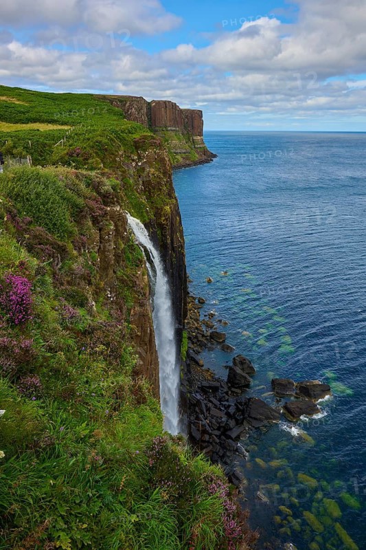 Impressive coastal landscape with waterfall and steep ocean cliffs, Kilt Rock Waterfall, Portree, Isle of Skye, Scotland, United Kingdom, Great Britain