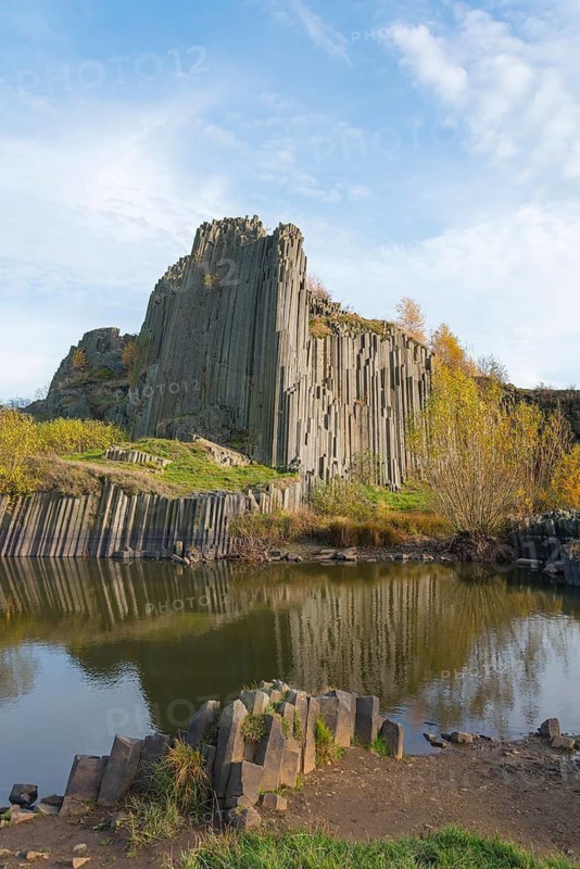 A charming landscape with basalt columns and calm water in an autumn scene, manor rocks, Panska skala, basalt elevation, natural monument, Prachen, Parchen, Kamenicky Senov, Steinschönau, Czech Republic