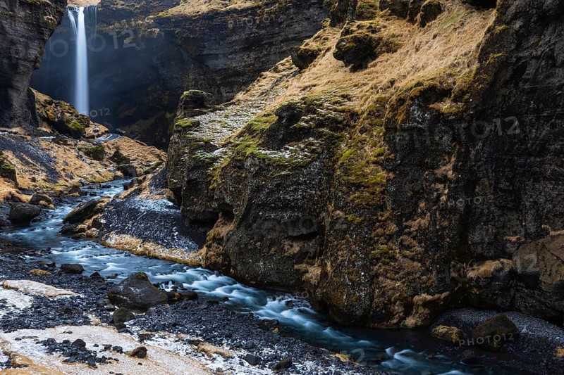 Waterfall with stream in lava rock gorge, winter, snow, Kvernufoss, Skogar, Iceland, Scandinavia