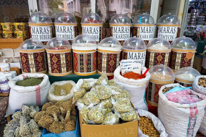 A market stand with a variety of spices in traditional containers, Markt, Karahayit, Karahiyit, Pamukkale, Denizli, Turkey