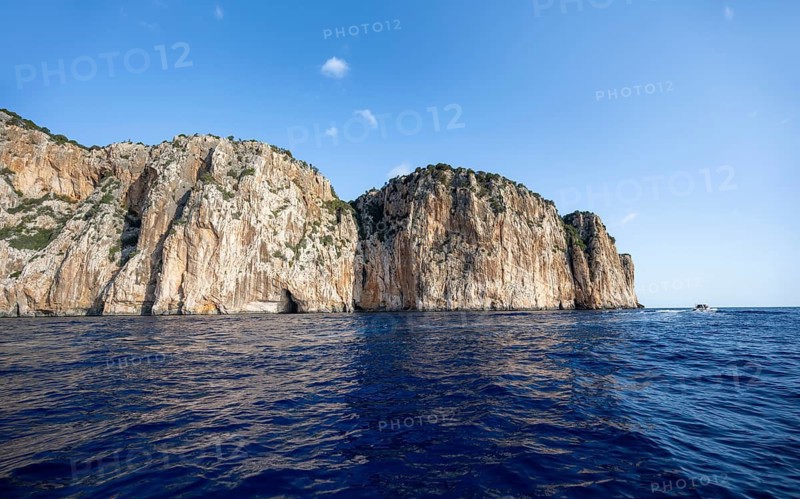 Picturesque rocky coast, cliffs and blue sea, Golfo di Orosei, Baunei, Sardinia, Italy