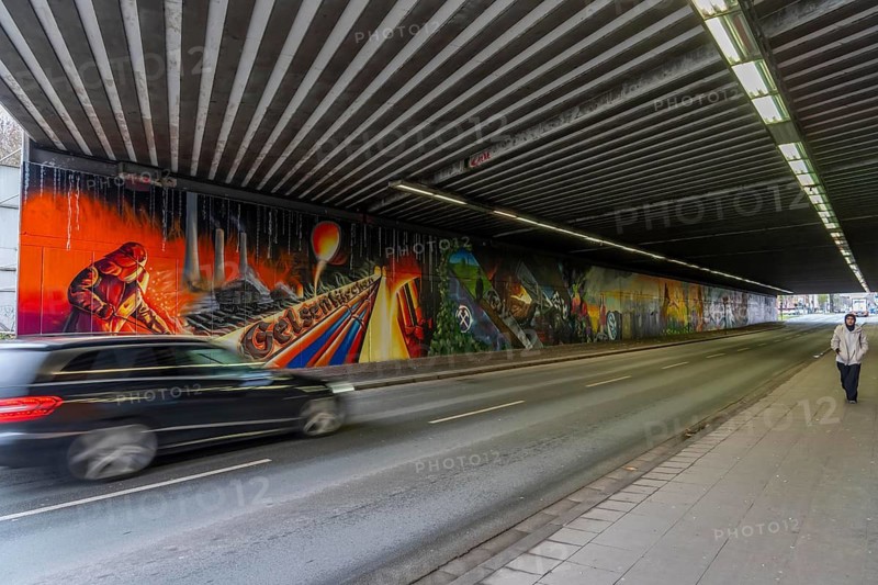 Huge street art pictures in a road tunnel in Gelsenkirchen, the approximately 120 meter long railway underpass of Wickingstraße was extensively painted and sprayed on both sides by 11 Gelsenkirchen graffiti artists and collectives, over a total length of 174 meters, the wall paintings showed motifs from Gelsenkirchen history, from economy, coal, steel, soccer, culture, life, on the 150th anniversary of the city on 29.11.11.25, North Rhine-Westphalia, Germany