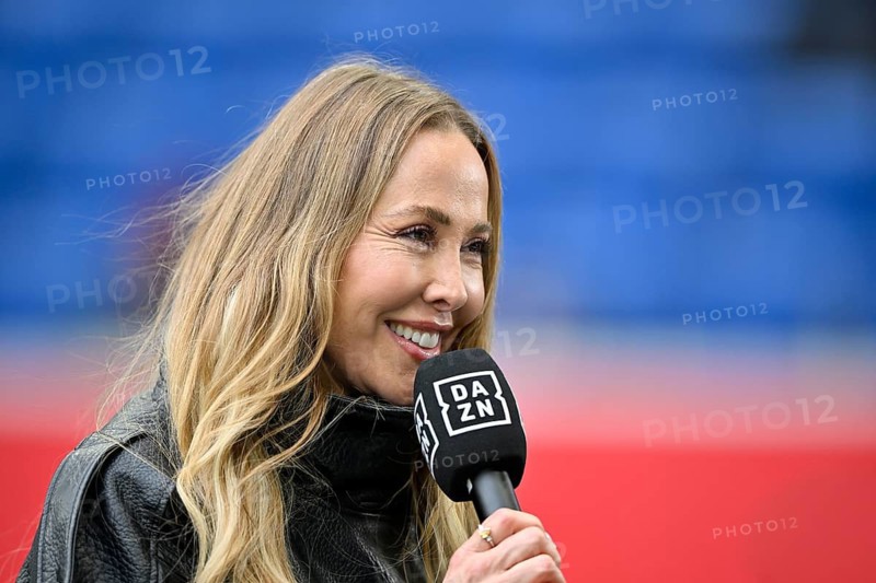 DAZN presenter reporter Sylvia Walker, portrait in interview microphone micro logo smiling, friendly, soccer Bundesliga, PreZero Arena, Sinsheim, Baden-Württemberg, Germany