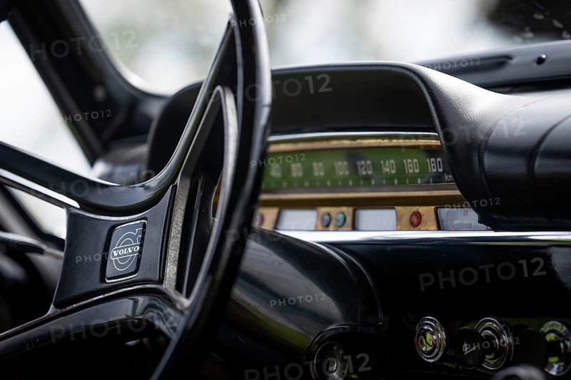 Steering wheel, dashboard with speed indicator, classic car, black Volvo Amazon, medium class car from Swedish car manufacturer Volvo, built in 1968