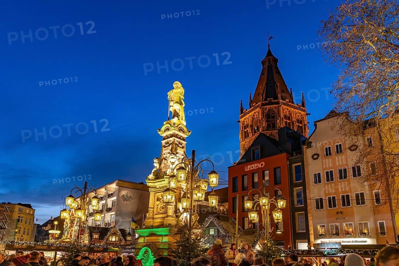 Christmas market Heinzel's winter fairy tale on Jan von Werth-Brunnen at dusk, Alter Markt, Cologne, North Rhine-Westphalia, Germany