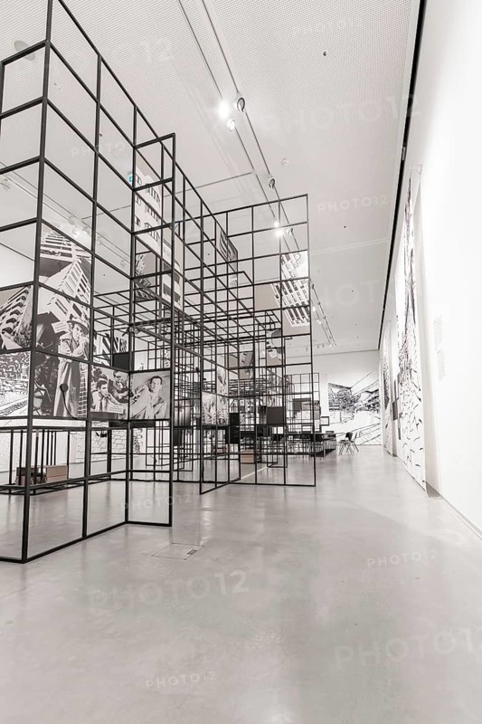 Modern art gallery with grid structures and black and white decorations that create an industrial atmosphere, Berlin, Germany