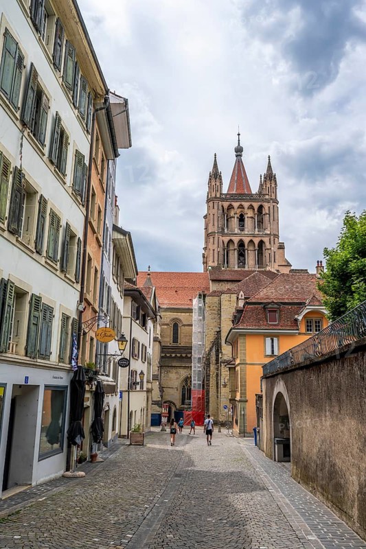 Alley in the Cité and tower of Notre Dame de Lausanne Cathedral, historic old town, Lausanne, Vaud, Switzerland