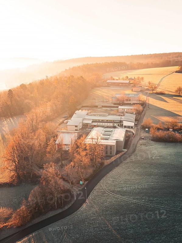 Aerial view of a landscape with buildings, hills, fields and a warm autumn atmosphere in the morning light, Weil der Stadt, Böblingen district, Germany