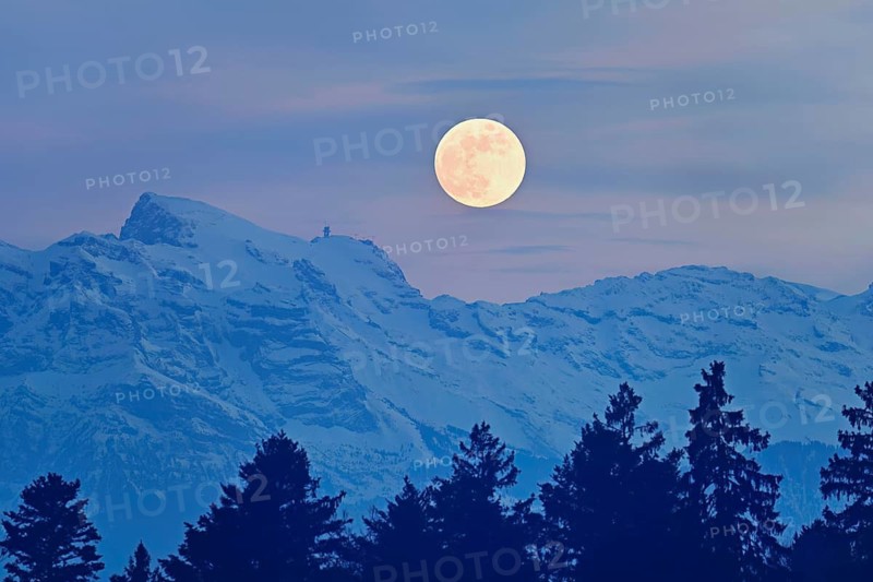 Full moon over snow-covered Titlis, Freiamt, Horben, Lindenberg, Aargau Canton, Switzerland