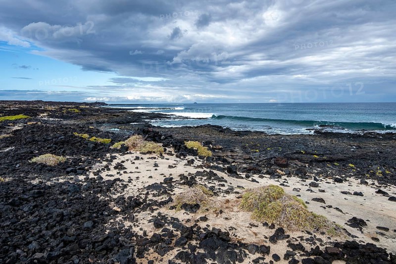 Sandy and rocky coast with volcanic stones, Playa de la Pequeña, Punta Usaje, Lanzarote, Canary Islands, Spain