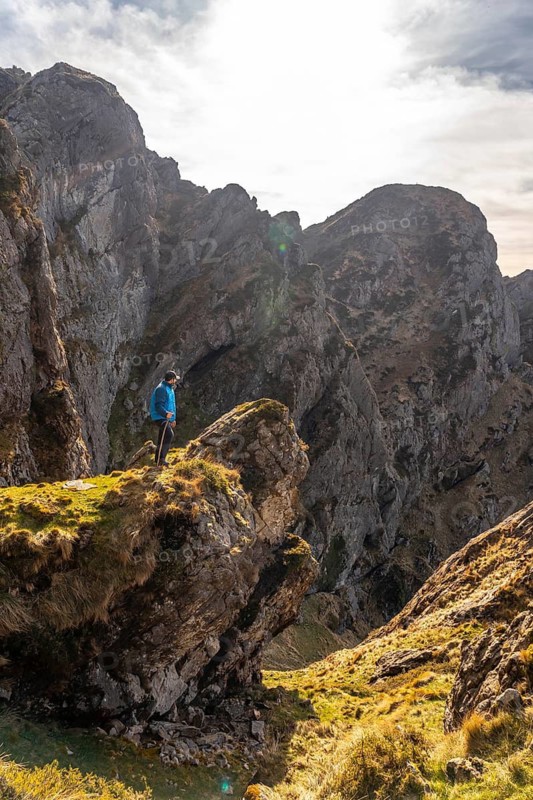 A young man enjoying at the top of the mountain of Aiako Harria or Peñas de Aya in the town of Oiartzun, Guipúzcoa. Basque Country