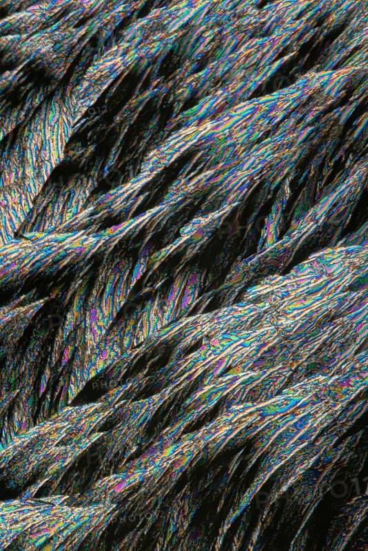 A vibrant image showcasing vivid Vitamin C crystals under microscopic view, highlighting intricate details and a spectrum of shimmering colors from blues, greens to reds