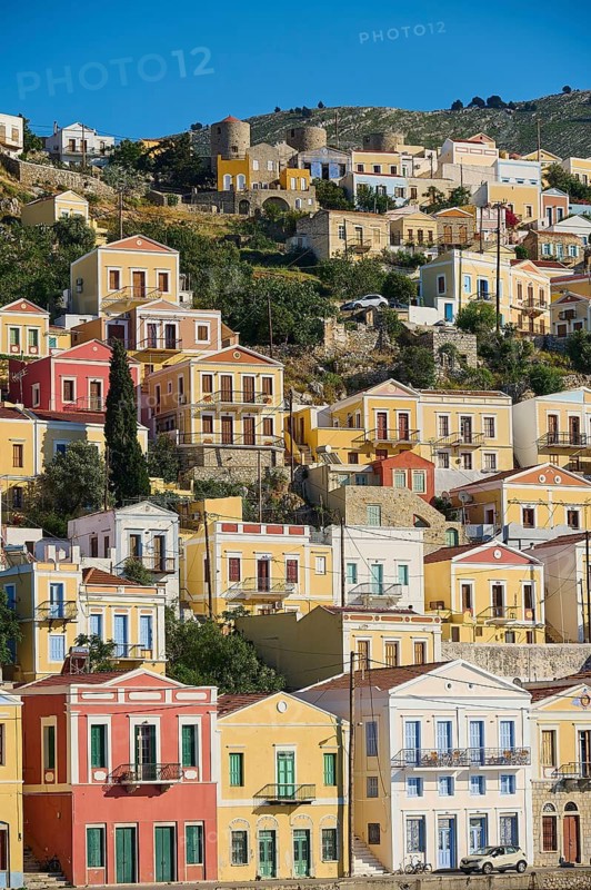 Colourful houses on a hill with clear sky, Symi Town, Symi, Dodecanese, Greek Islands, Greece