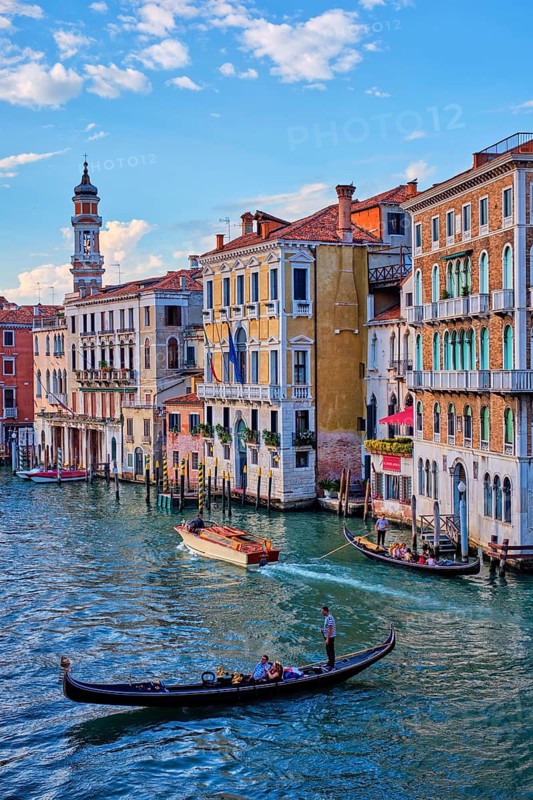 VENICE, ITALY, JUNE 27, 2018: Grand Canal with boats and gondolas on sunset, Venice, Italy
