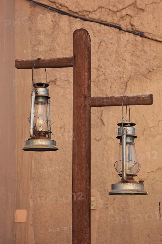 Lamps at Nizwa Fort. Nizwa is the centre of the Omani heartland. The oasis city lies on the southern edge of the Hajar Mountains near the Jabal al-Achdar, Oman's highest mountain range