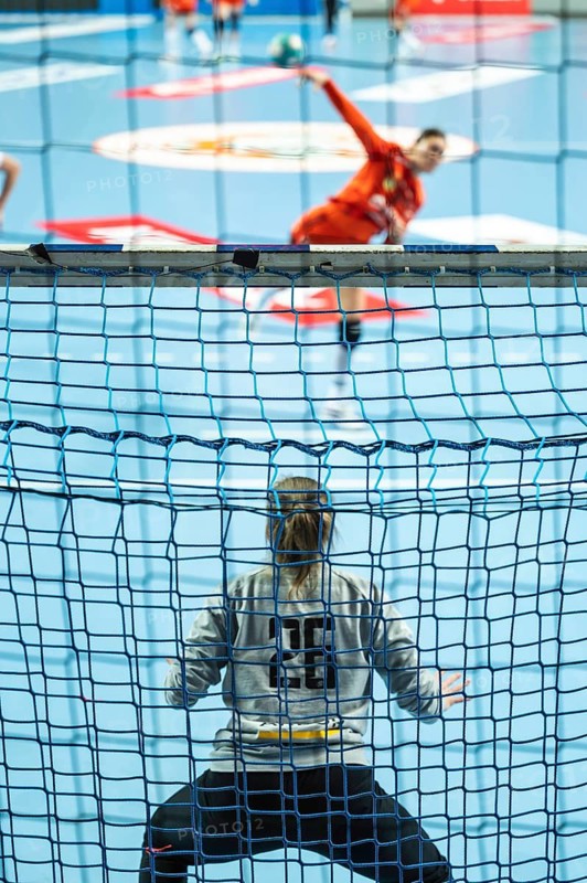 Detail of handball goal crossbar with net penalty shot in the background