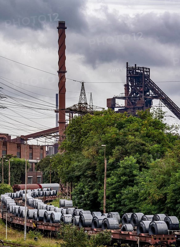 Blast furnace Schwelgern 2, strip steel rolls, coils, on freight wagons, at the ThyssenKrupp Steel plant Schwelgern in Duisburg-Marxloh belongs to the Bruckhausen steelworks, North Rhine-Westphalia, Germany