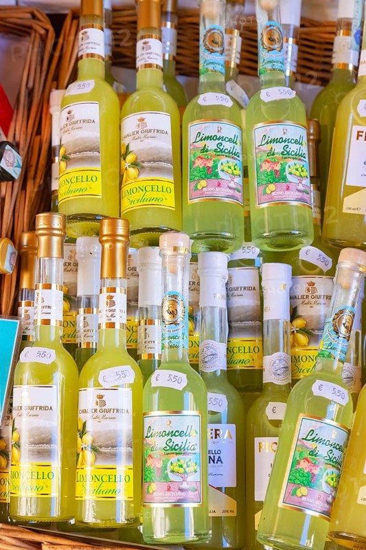 Bottles of limoncello liquor on sale, Taormina, Sicily, Italy