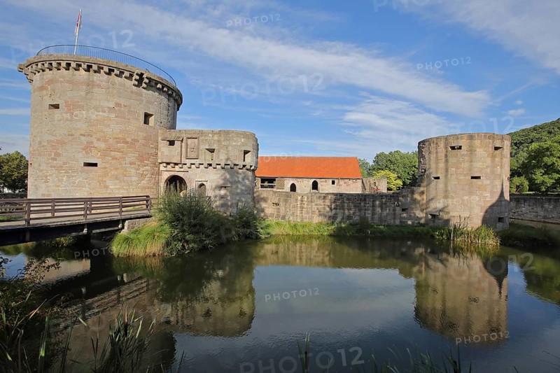 Historic medieval moated castle, fortification, bulwark, towers, reflection, pond, Friedewald, Hesse, Rhön, Germany