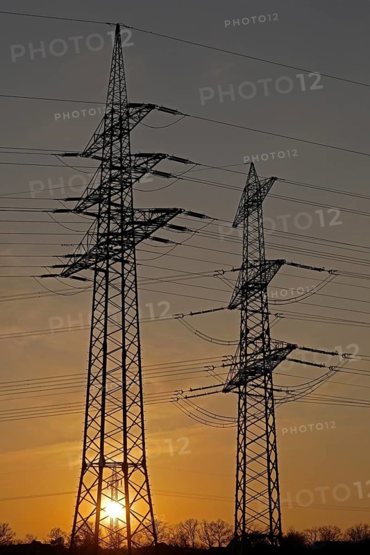 Sunset behind high-voltage pylons, Häcklingen, Lüneburg, Lower Saxony, Germany
