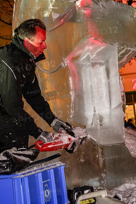An ice sculpture is being created: ice carving street action as part of the long shopping night in the city center of Reutlingen, Baden-Württemberg, Germany, for editorial use only