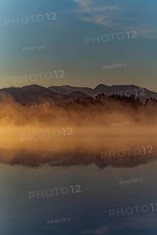 Autumnal morning atmosphere at Schmutter Weiher with fog near Lechbruck, Halblech and Roßhaupten in Allgäu, Bavaria, Germany
