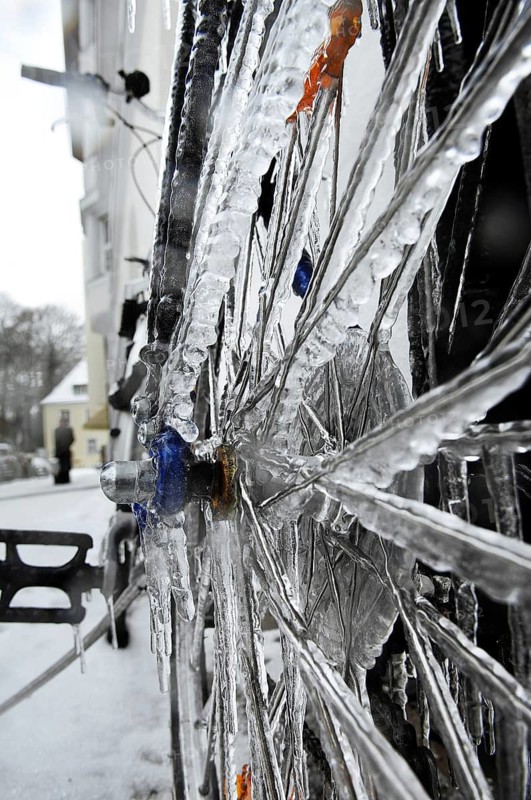 Bicycle icy due to freezing rain, icicles, detailed view