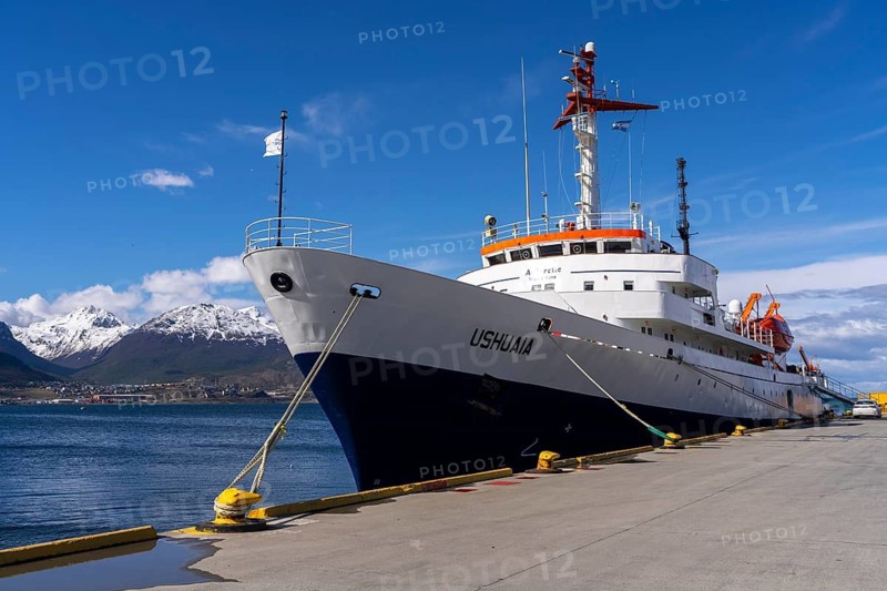 Ushuaia expedition ship from Antarpply Expeditions lying on the pier, snow-capped mountains of the Martial Mountains in the background, port of Ushuaia, Tierra del Fuego, Argentina