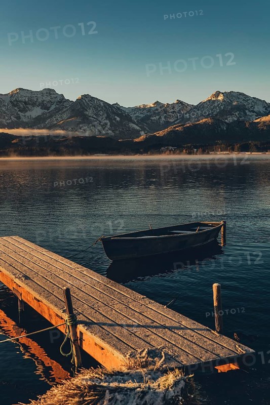 Frosty morning atmosphere during sunrise at Lake Hopfensee in the Allgäu in Bavaria, Germany