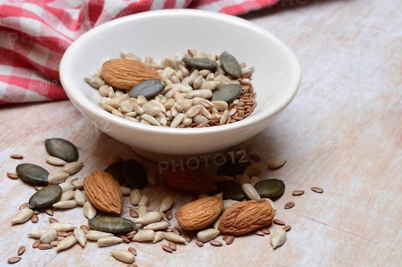 Kernels in shell, kernel mix of almond seeds, sunflower seeds, linseeds and pumpkin seeds