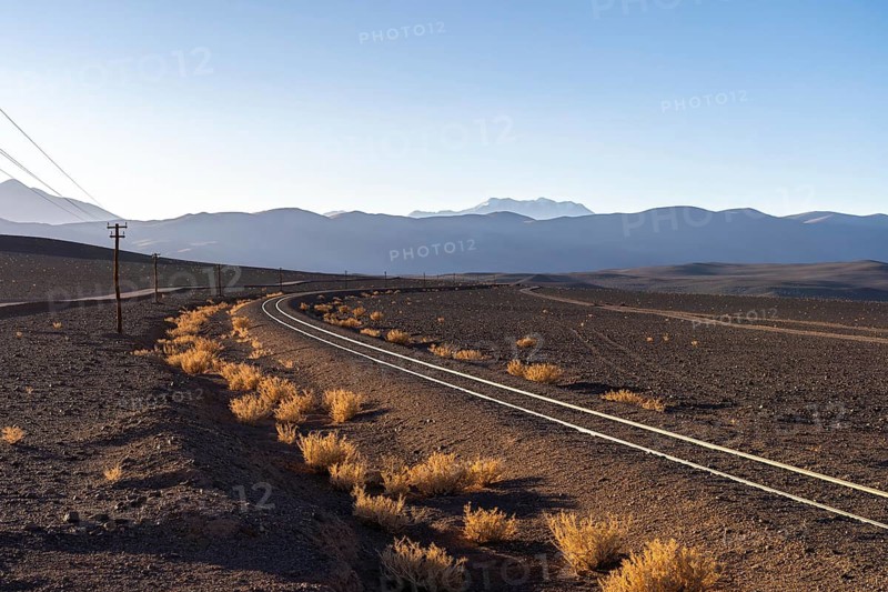 Captivating view of railroad tracks snaking through the desolate and scenic landscape of La Puna in Argentina