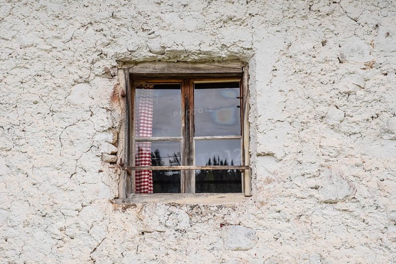 View of the window of a hut on the Glatsch Alm, Dolomites, Puez-Geisler nature park Park, Odle Group, St. Magdalena, Funes, Villnöss Valley, South Tyrol, Italy