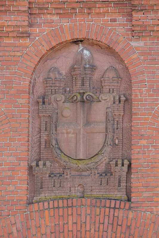 Red city coat of arms with stone, old slaughterhouse, brick building, monochrome, Bruchsal, Baden-Württemberg, Germany