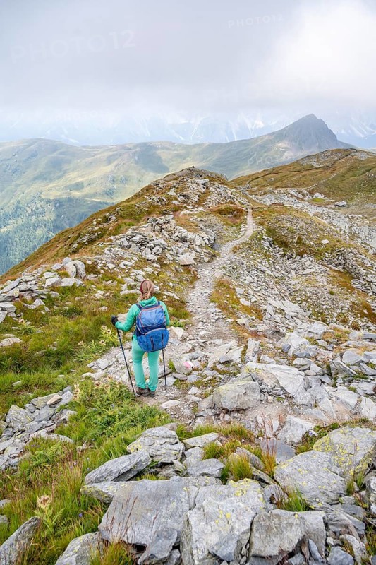 Hiker on hiking trail, Carnic Main Ridge, Carnic High Trail, Carnic Alps, Carinthia, Austria