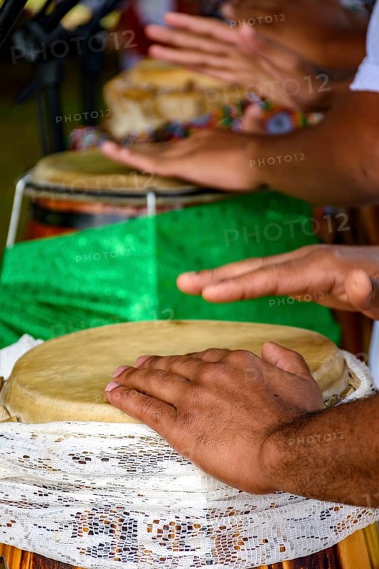 Several atabaque drums decorated with fabric being used during an Umbanda religious ceremony in Brazil Belo Horizonte, Minas Gerias, Brazil