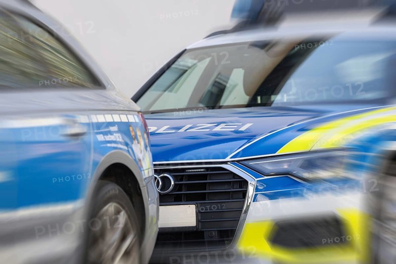 Symbolic image of police operation: close-up of police emergency vehicles