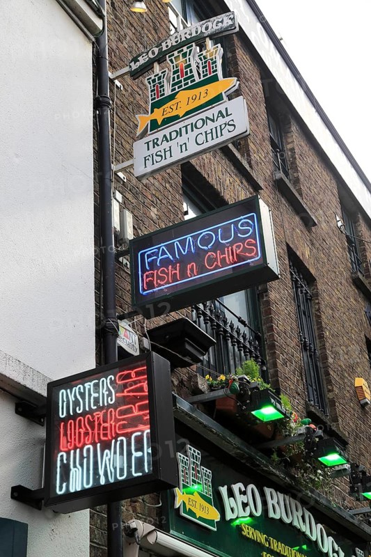 Food signs outside fish and chips restaurant, Dublin city centre, Ireland, Republic of Ireland