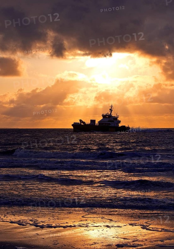 Sea at sunset with the offshore supply vessel FARRA CLIONA, North Sea, Norderney Island, East Frisia, Lower Saxony, Germany