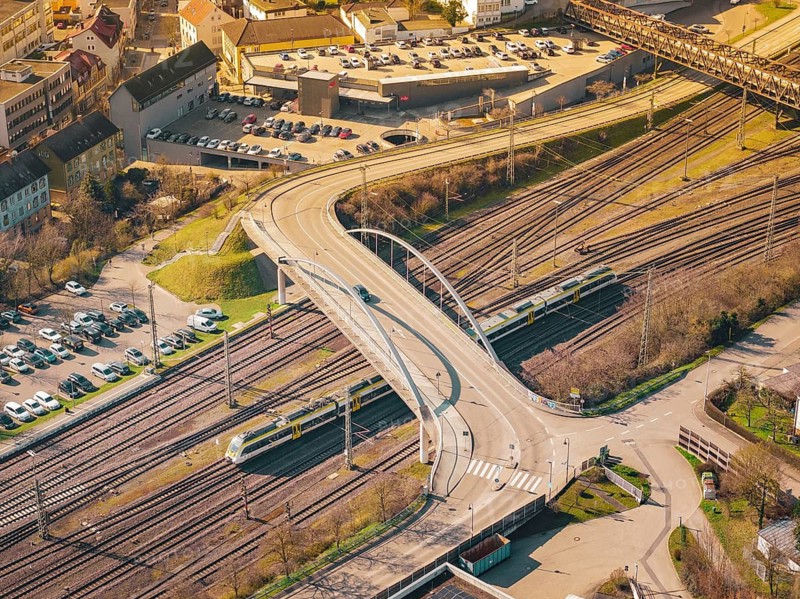 The urban bridge structure with vehicles over a railway rail network, Mühlacker, Enzkreis, Germany