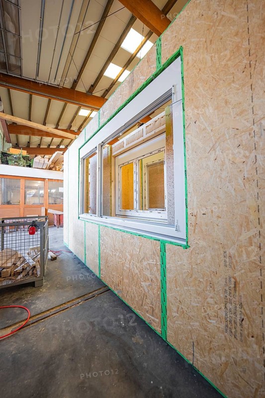 Wooden wall with prepared window opening in a factory building, modern construction, façade construction in carpentry, climate-friendly construction, Nagold, Germany